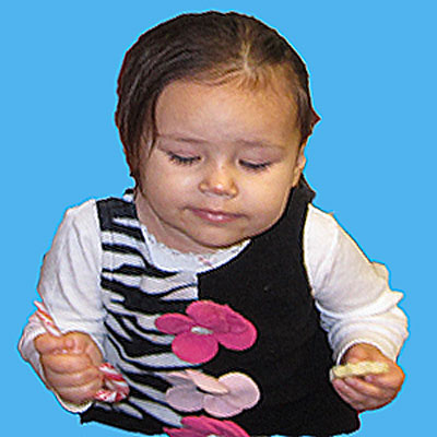 A baby eating candy