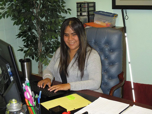 Juanita Herrera at the front desk