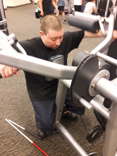 Danny is working his arms at LA Fitness