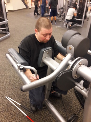 Danny is working out on one of the machines at LA Fitness