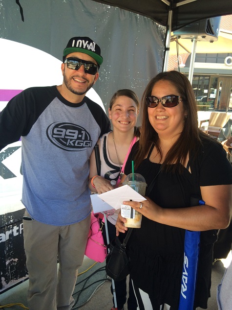 Priscilla and Dani taking a picture with the radio host from KGGI at the Riverside Plaza RTA event