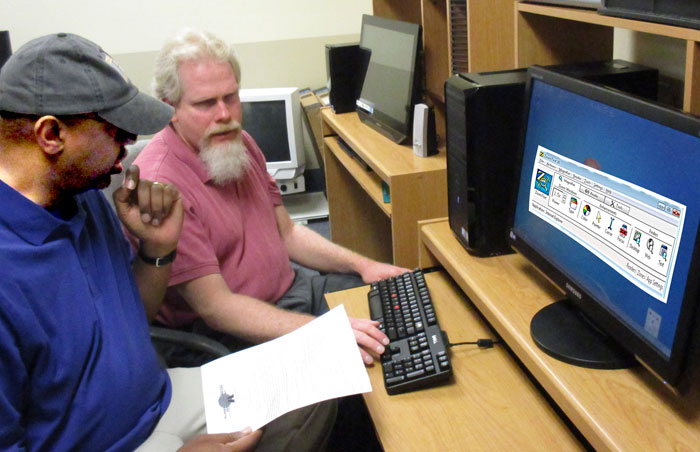 An Assistive Technology Specialist is training a student how to use a computer