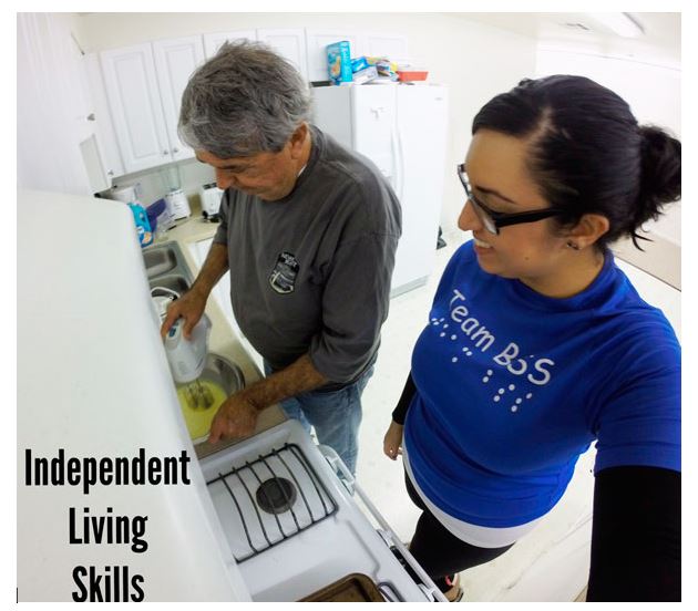 Independent living skills instructor teaching a blind student how to cook