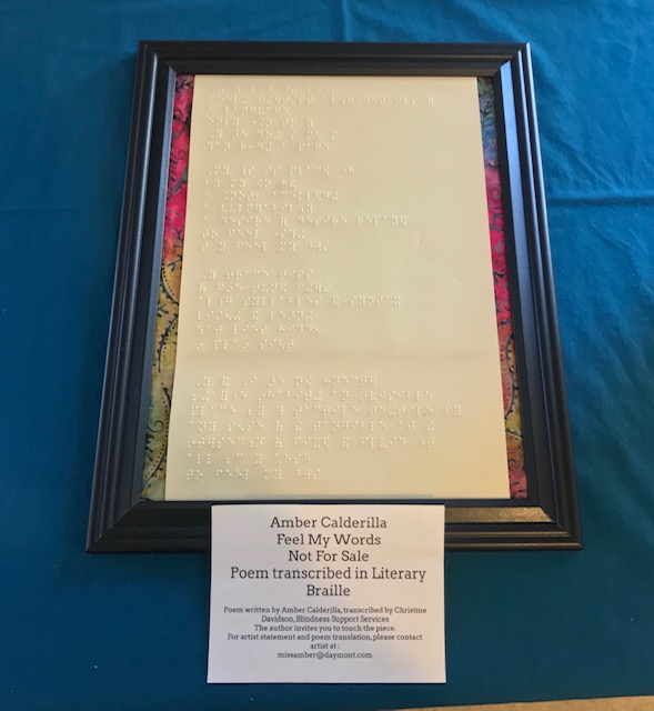 a frame with the poem brailled out and an information card below